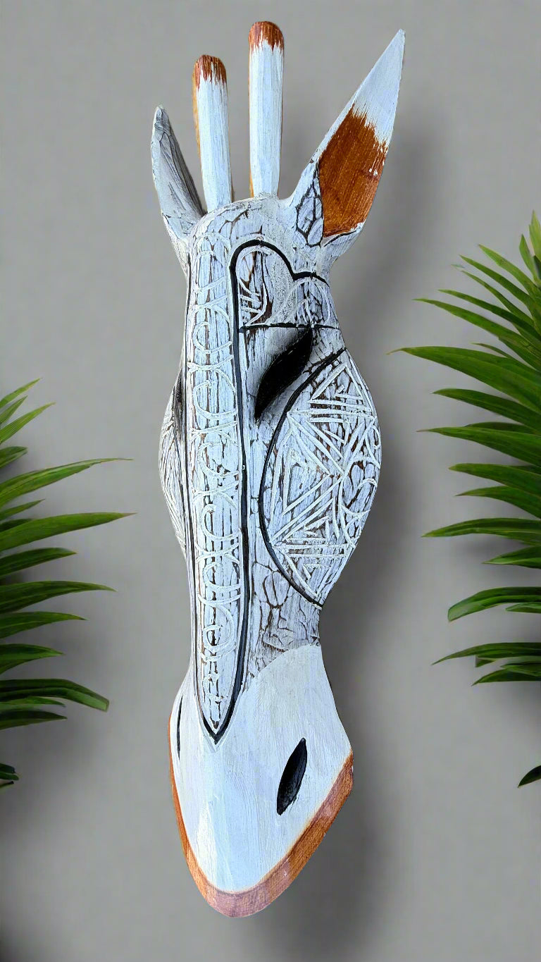 Wooden hand sculpture with tribal geometric carvings and distressed white finish