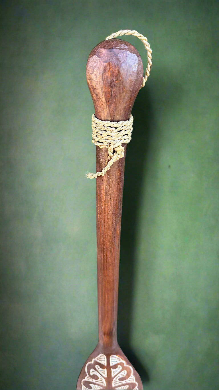wooden staff with rope-wrapped knob and decorative spoon-end