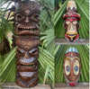 Collage of wooden tiki masks with tribal carvings among green palm leaves