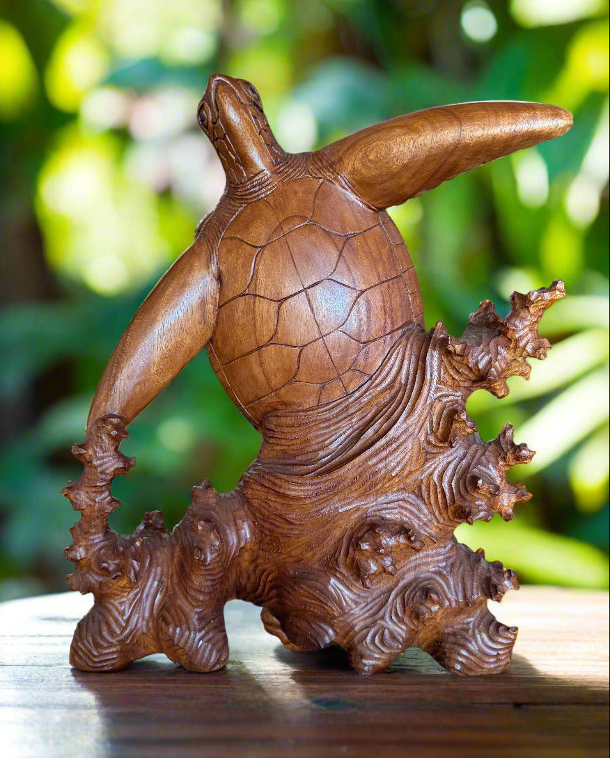 Carved wooden turtle sculpture with detailed shell and textured driftwood base