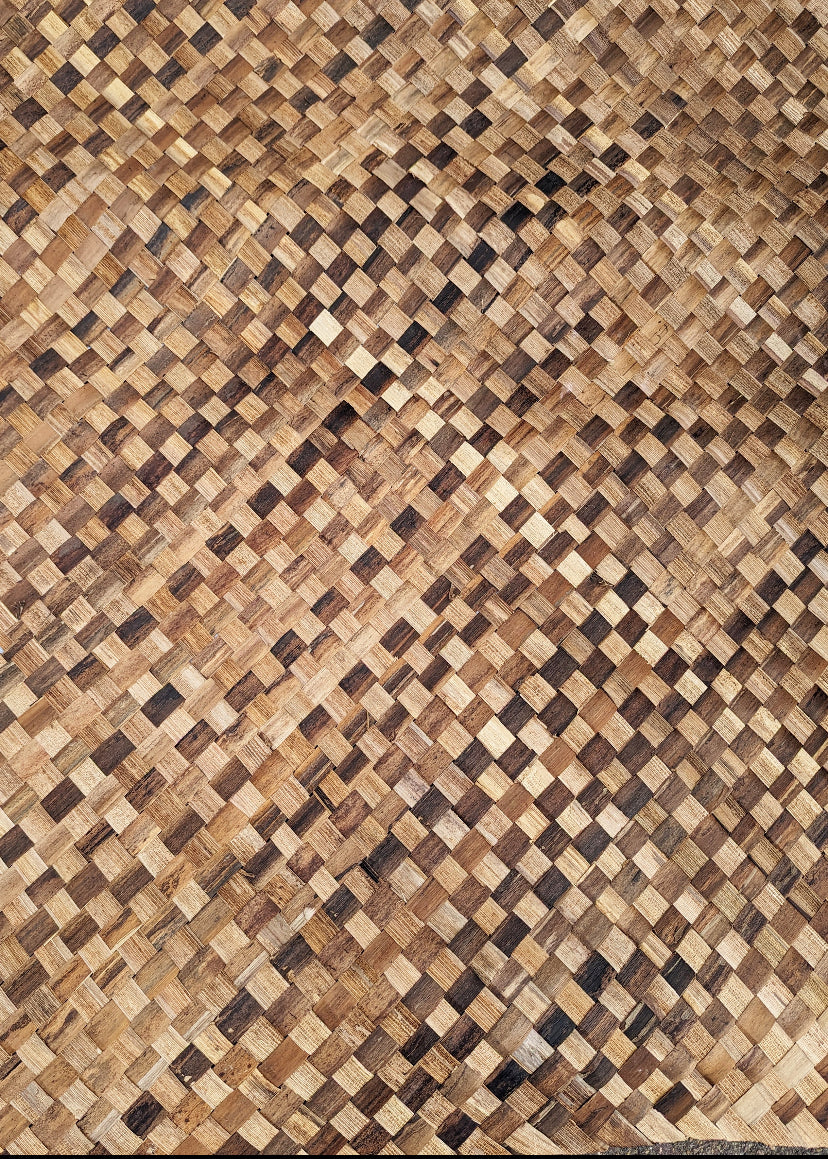 Close-up of a woven wooden pattern with interlaced squares in natural brown tones.