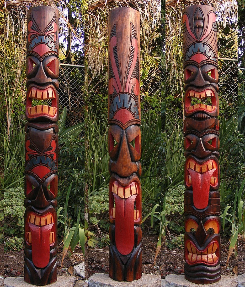 Colorful carved tiki totem pole with multiple faces in a garden