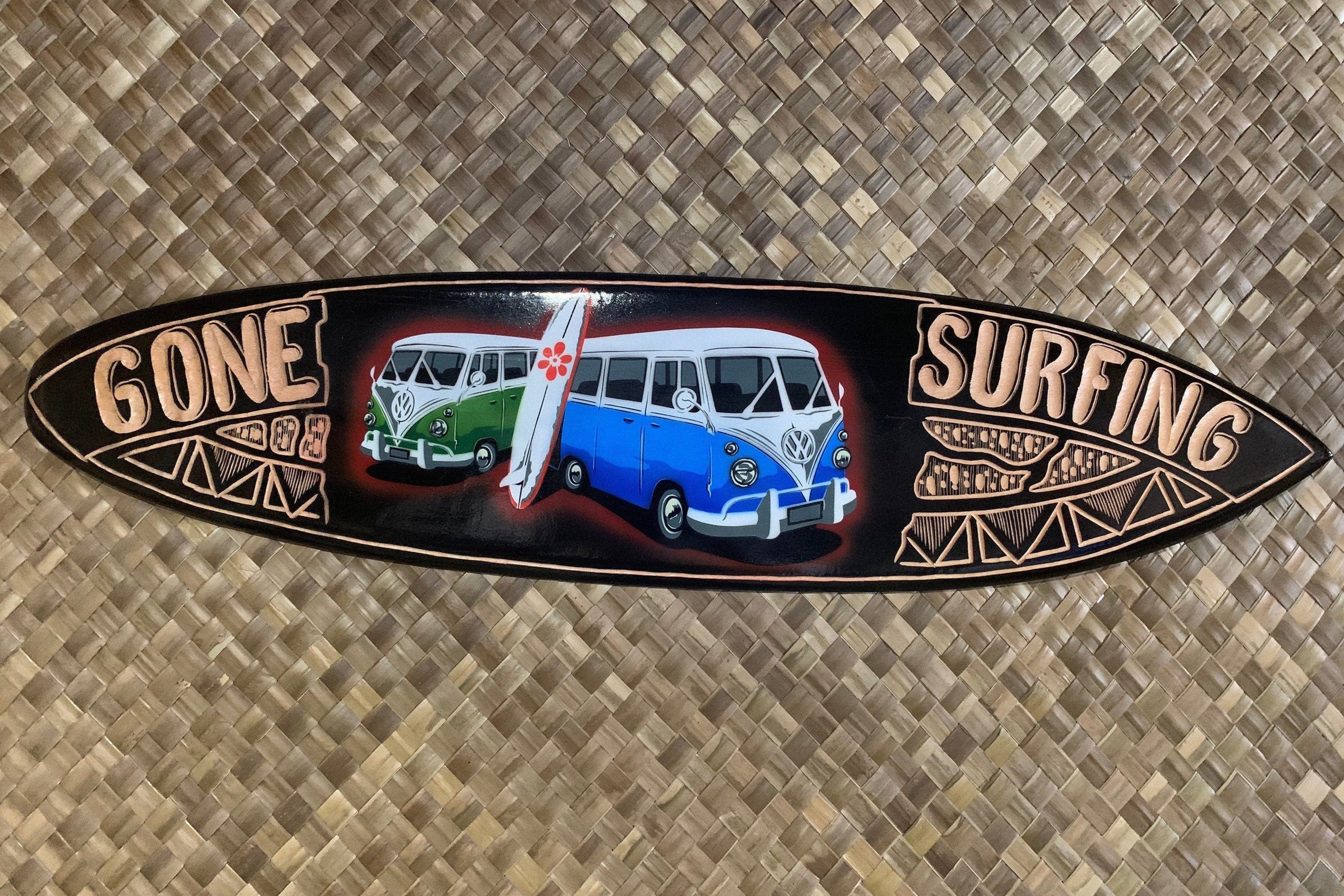 Retro black surfboard sign with green and blue VW buses and a surfboard, GONE SURFING