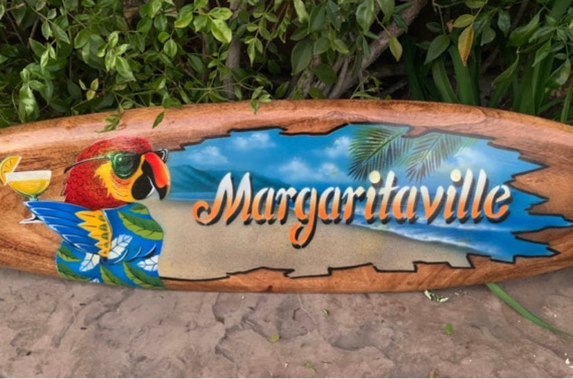 Margaritaville wooden sign with parrot and tropical scene