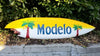 Modelo surfboard with yellow gradient and palm tree graphics
