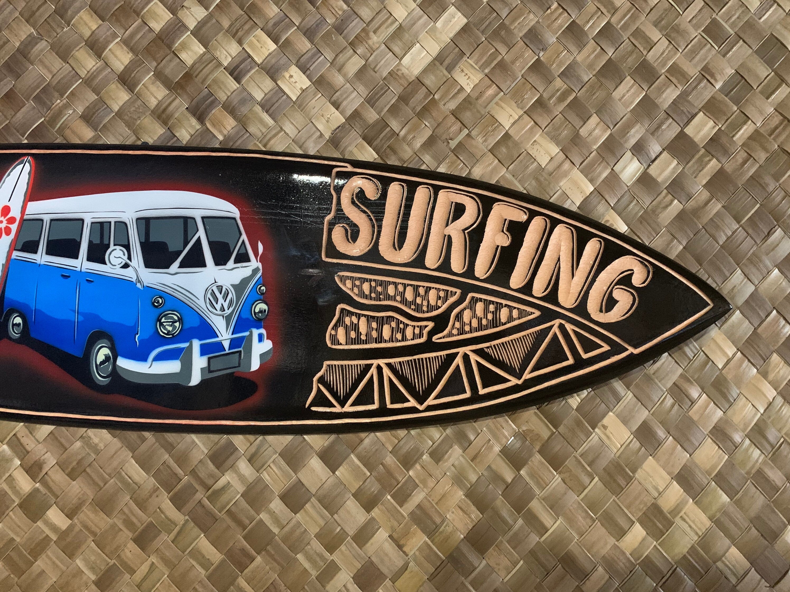 retro VW bus on a surfboard with SURFING text and geometric patterns