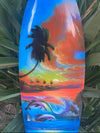 Colorful tropical sunset surfboard art with palm trees, an island, and dolphins.