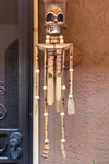 wooden skeleton wind chime with skull head